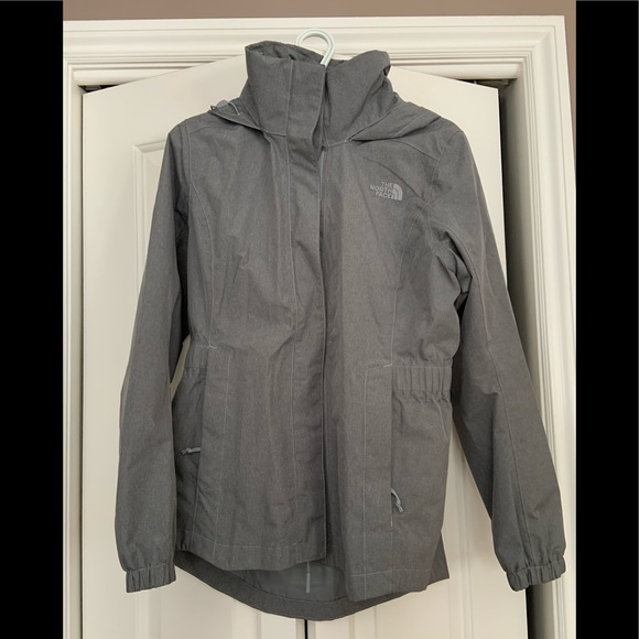 Barely used, grey North Face rain jacket. Hood folds in. - Picture 1 of 4